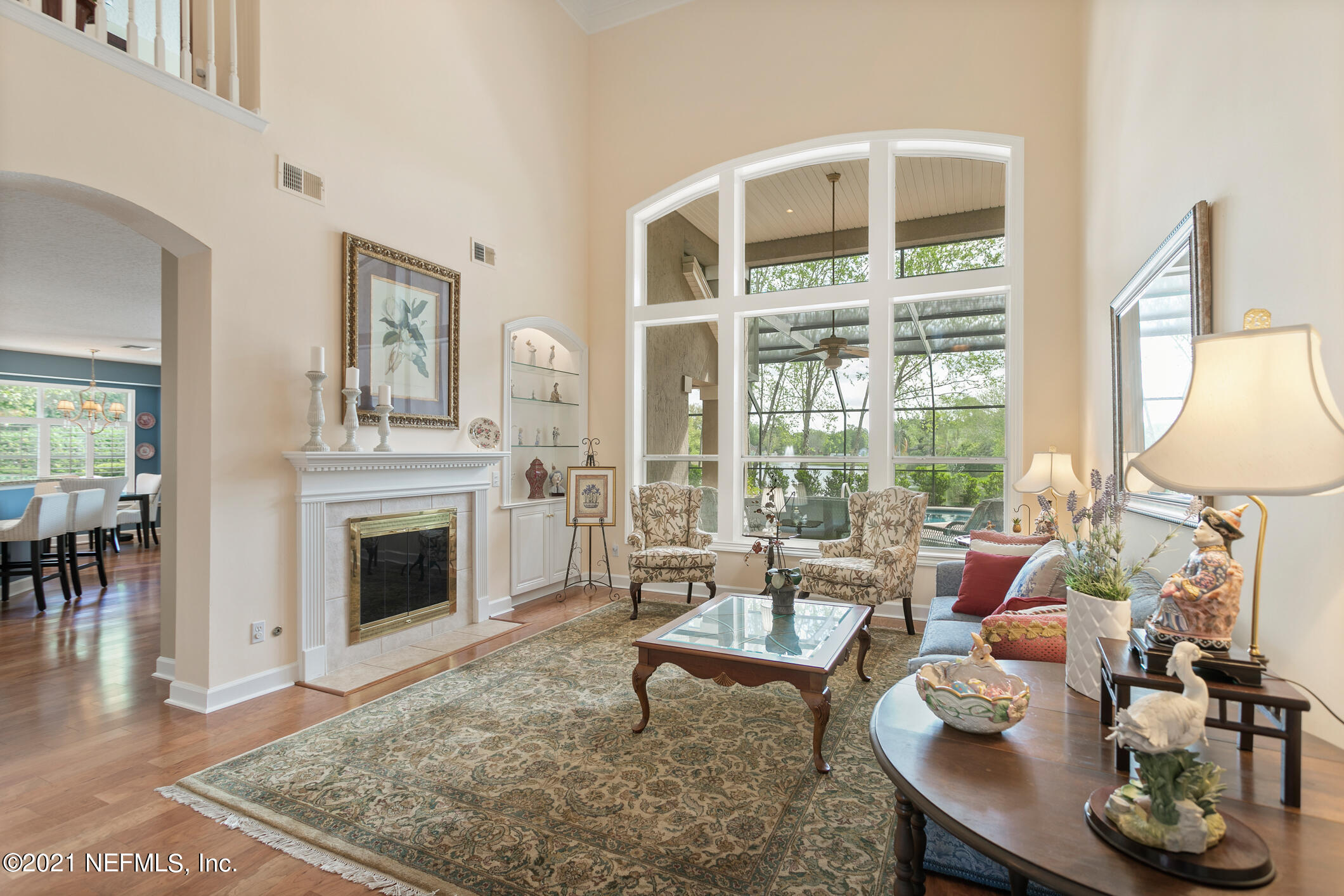 1508 Hackberry Court St. Johns, FL 32259 - Photo 8 of 47 a living room with furniture large window and a fireplace