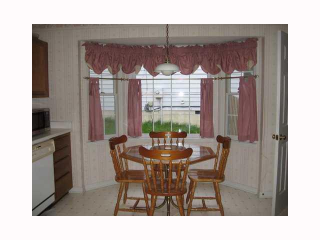 3708 Old Coach Road Raleigh, NC 27616 - Photo 2 of 7 a view of a dining room with furniture and chandelier
