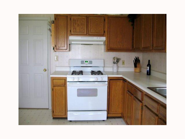 3708 Old Coach Road Raleigh, NC 27616 - Photo 3 of 7 a kitchen with a sink cabinets and appliances