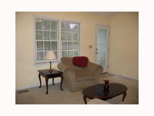 3708 Old Coach Road Raleigh, NC 27616 - Photo 5 of 7 a living room with furniture and a lamp