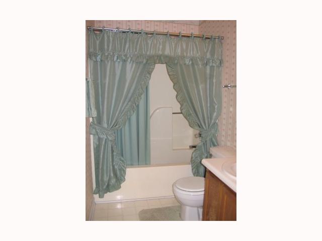 3708 Old Coach Road Raleigh, NC 27616 - Photo 6 of 7 a bathroom with a toilet a sink and a bathtub