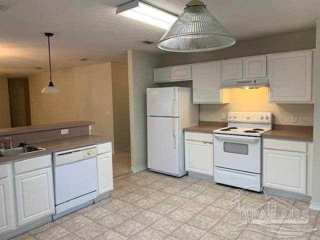 5466 Cherub Circle Milton, FL 32583 - Photo 3 of 13 a kitchen with a stove and a refrigerator