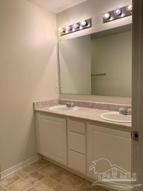 5466 Cherub Circle Milton, FL 32583 - Photo 7 of 13 a bathroom with a sink and a mirror