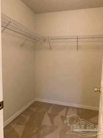 a bathroom with a shower and a glass door