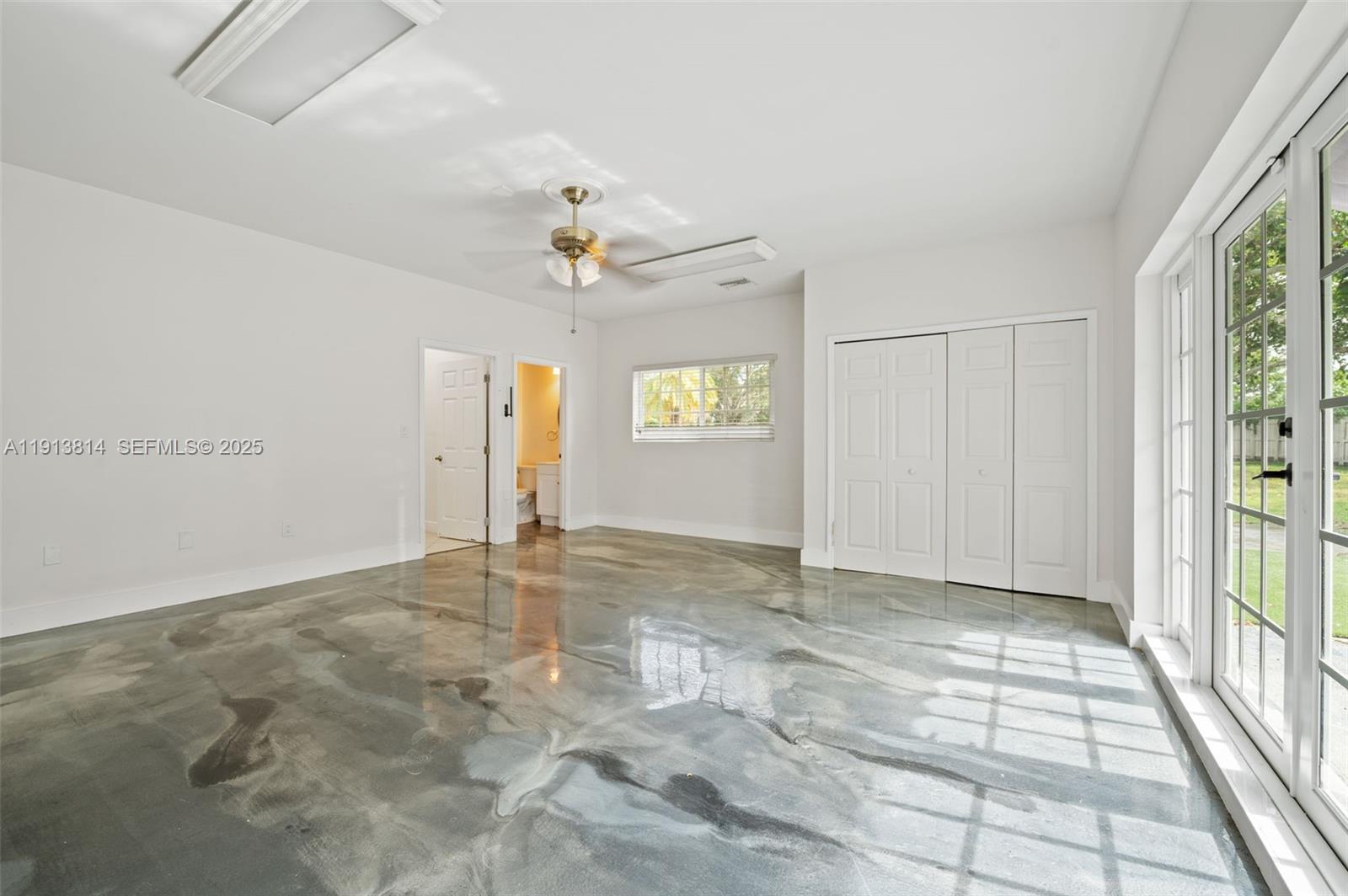 13000 Old Cutler Road Pinecrest, FL 33156 - Photo 16 of 45 a view of an empty room with a window