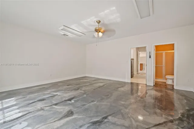 a bathroom with a toilet a sink and a mirror