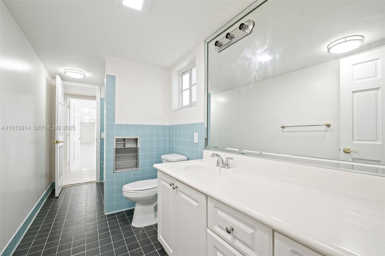 13000 Old Cutler Road Pinecrest, FL 33156 - Photo 22 of 45 a bathroom with a sink a toilet and shower