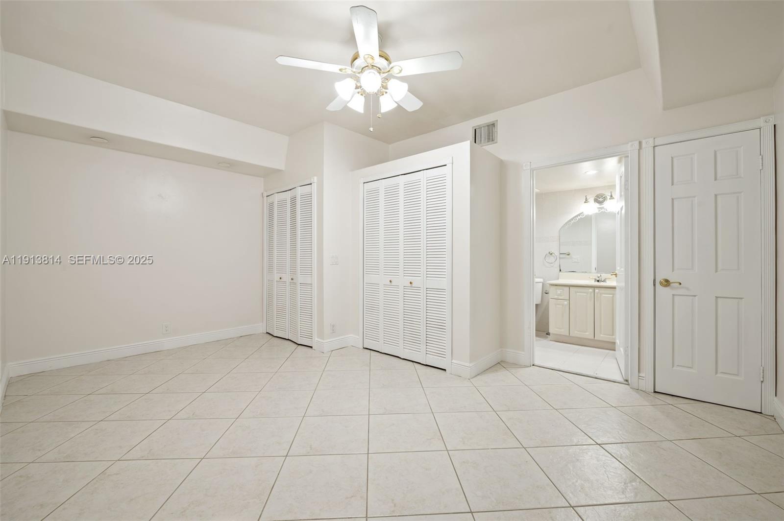 13000 Old Cutler Road Pinecrest, FL 33156 - Photo 23 of 45 an empty room with fan and entrance