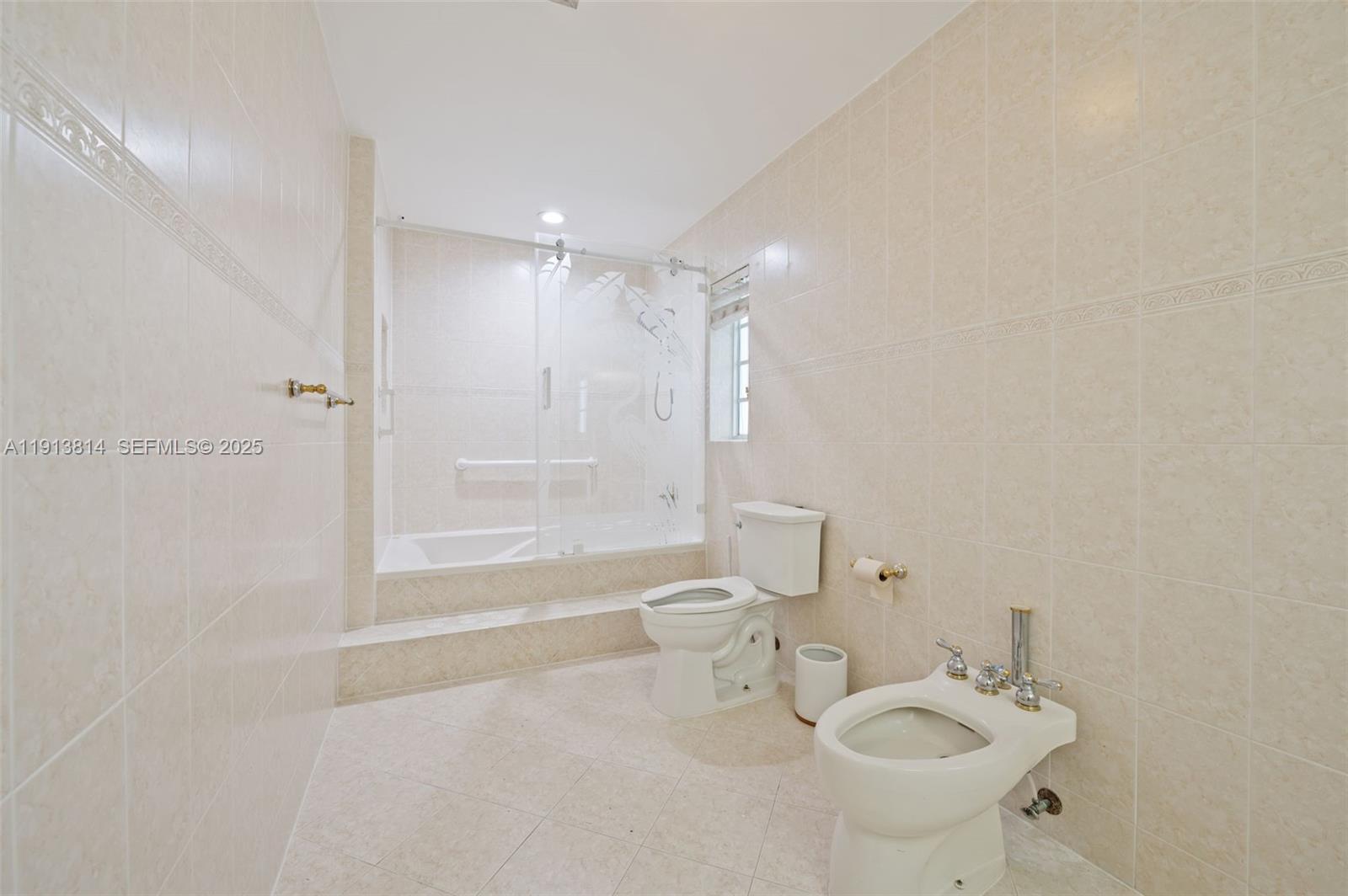 13000 Old Cutler Road Pinecrest, FL 33156 - Photo 27 of 45 a bathroom with a sink toilet and shower