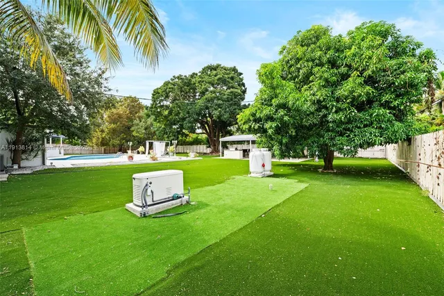 a table and chairs in the garden