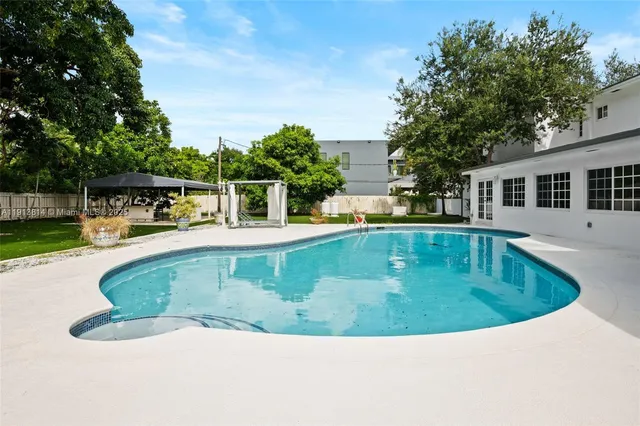 a view of a house with a swimming pool