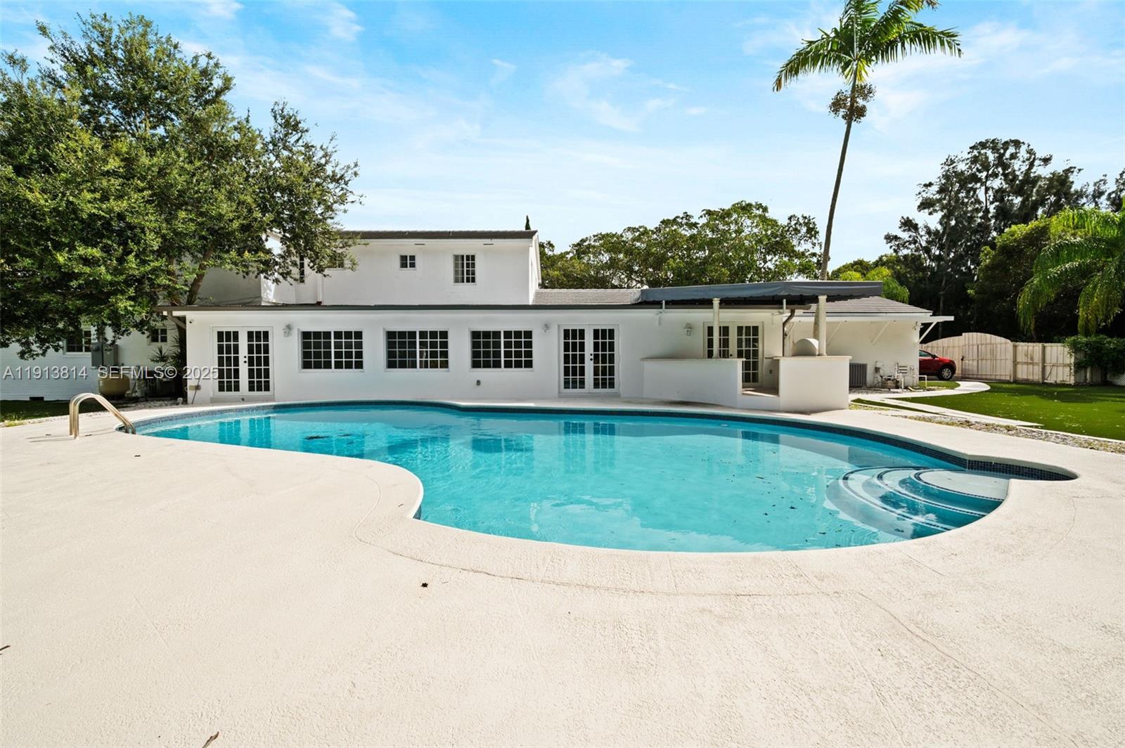 13000 Old Cutler Road Pinecrest, FL 33156 - Photo 42 of 45 a view of a house with a swimming pool
