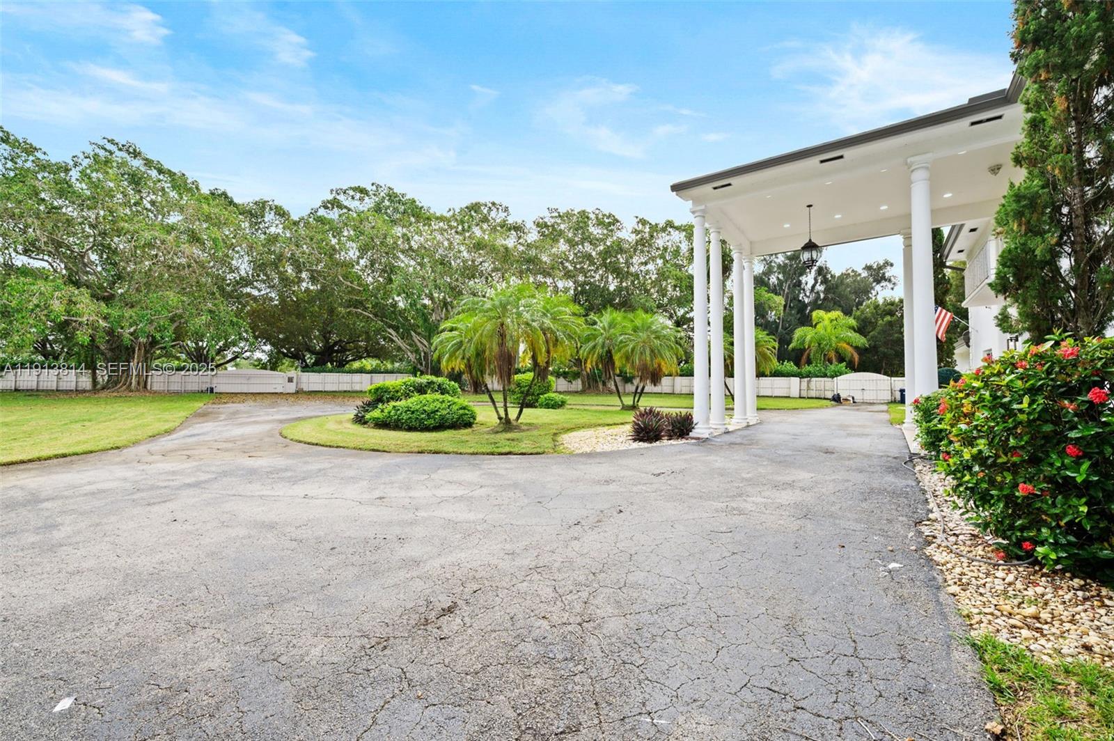 13000 Old Cutler Road Pinecrest, FL 33156 - Photo 43 of 45 a view of a fountain in front of a house