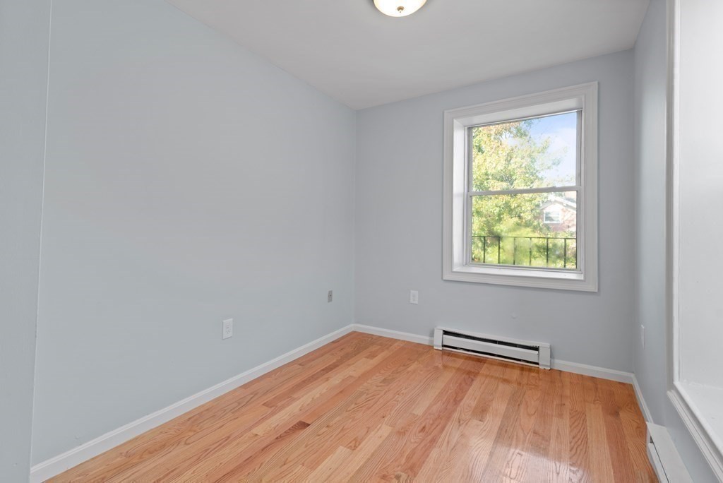 2 Woodbine Street, Unit 2 Boston, MA 02119 - Photo 16 of 26 an empty room with a window