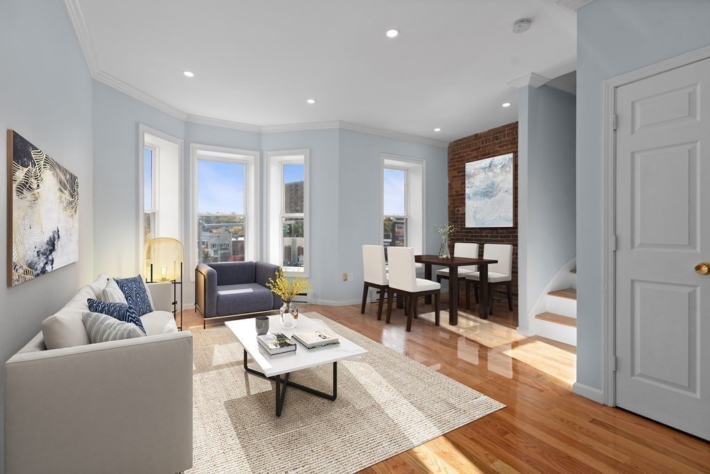 2 Woodbine Street, Unit 2 Boston, MA 02119 - Photo 3 of 26 a living room with furniture and wooden floor