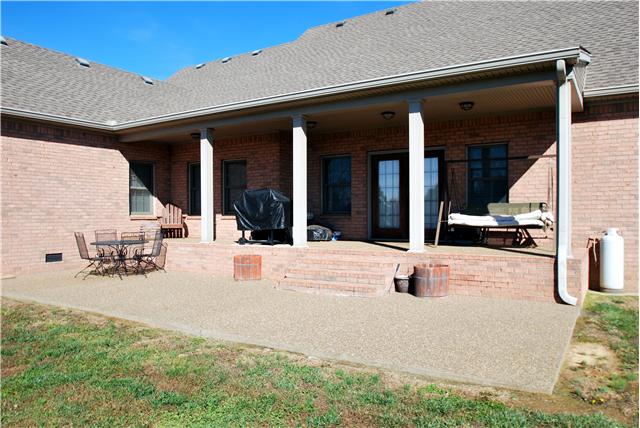 862 Coker Ford Road Portland, TN 37148 - Photo 16 of 20 Such a low maintenance home with all brick, covered porch, and aggregate patio.