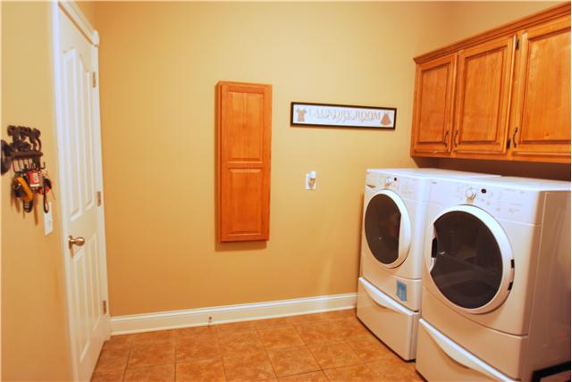 862 Coker Ford Road Portland, TN 37148 - Photo 9 of 20 Utility room is huge with separate soaking sink and built in custom cabinets