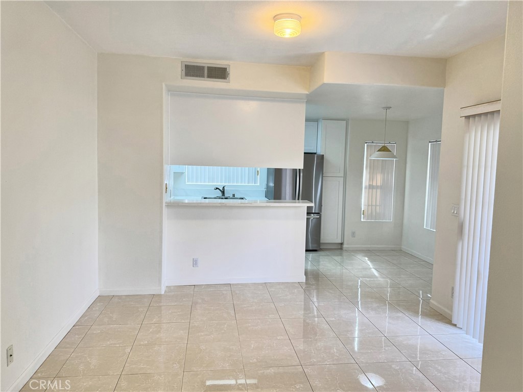 18319 Hart Street, Unit 3 Reseda, CA 91335 - Photo 6 of 18 a view of a kitchen with a sink