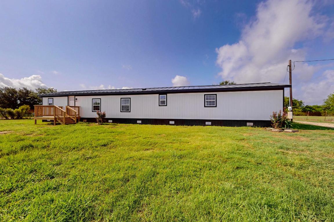 885 Shiloh Road Bastrop, TX 78602 - Photo 1 of 1 Front of house metal roof.