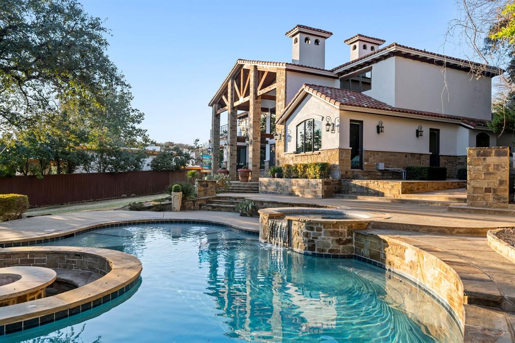 9930 Boat Club Road Fort Worth, TX 76179 - Photo 4 of 40 Enjoy a refreshing swim at the main house's stunning pool, nestled in a peaceful setting.