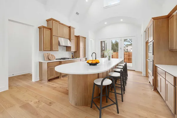 a dining room with furniture and wooden floor