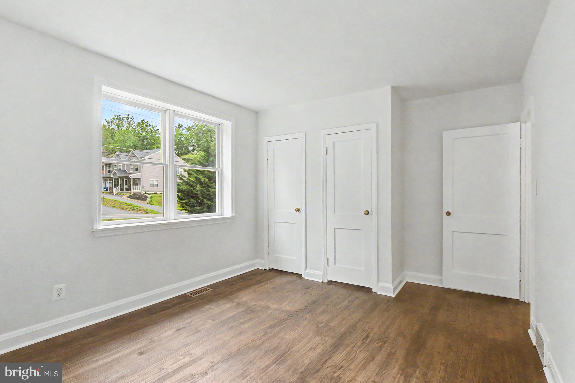 604 Prospect Mill Road Bel Air, MD 21015 - Photo 22 of 36 a view of an empty room with wooden floor and windows