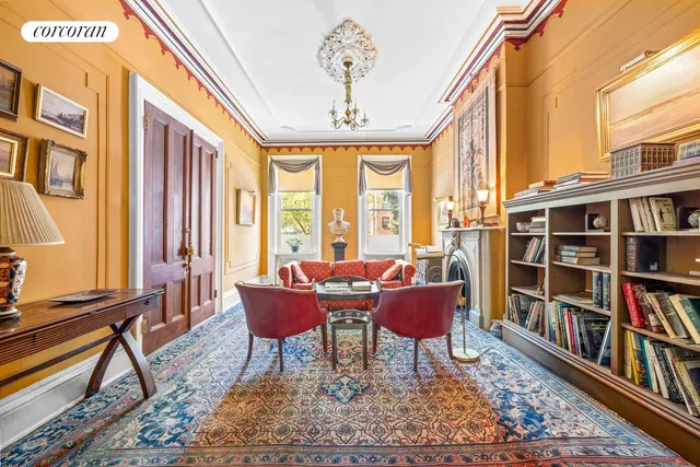 a living room with furniture or bookshelf and a window