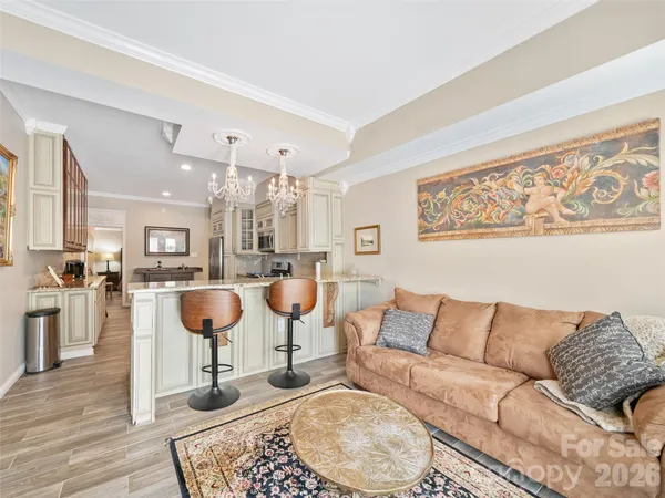 a bedroom with a bed a dresser and a book shelf