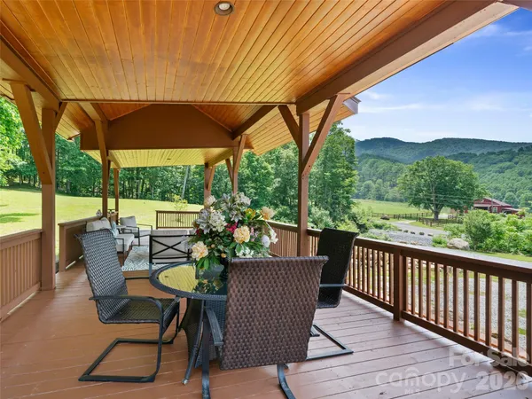 a view of a living room and chandelier or balcony
