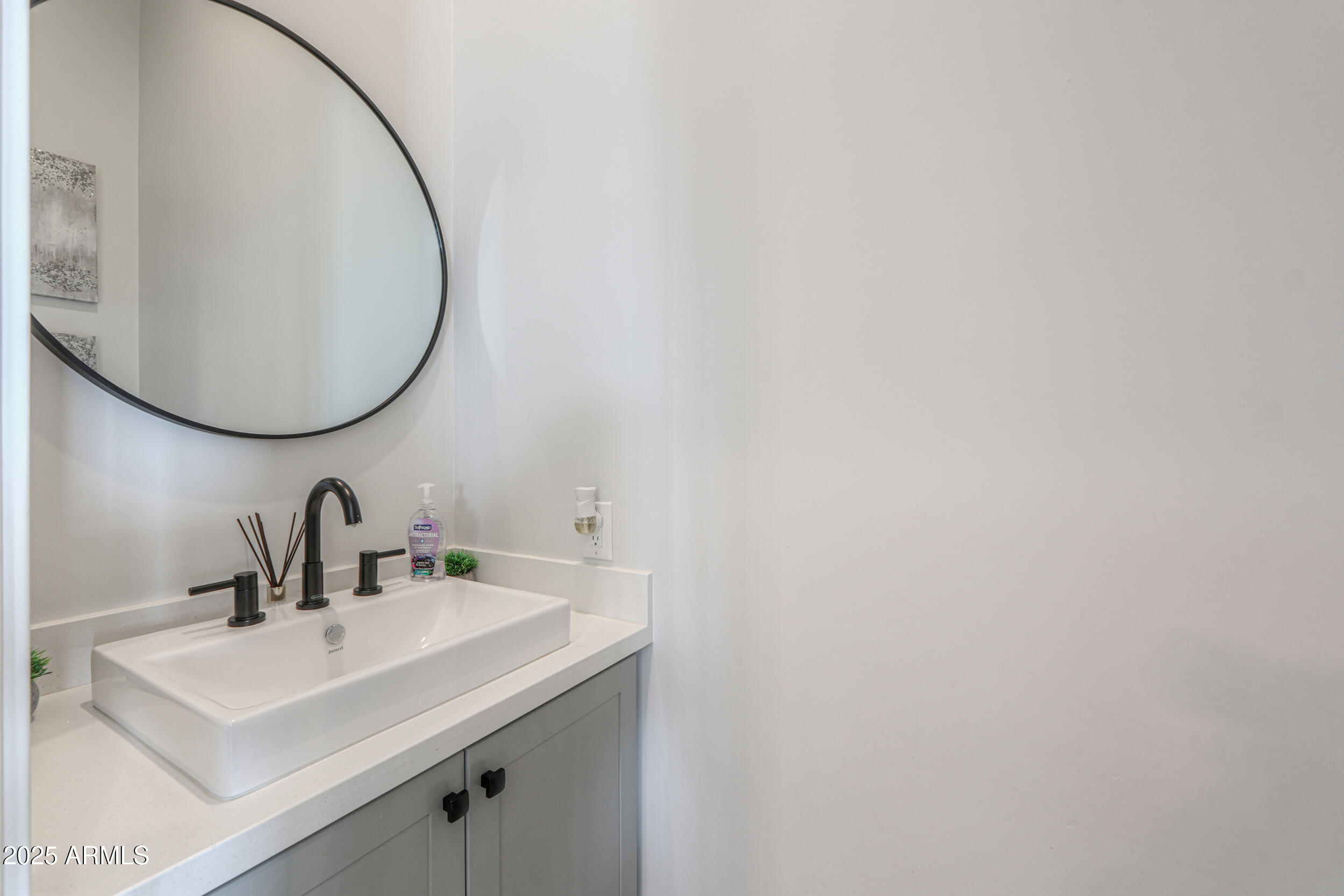 2529 West Magma Road San Tan Valley, AZ 85144 - Photo 16 of 93 a bathroom with a sink and mirror