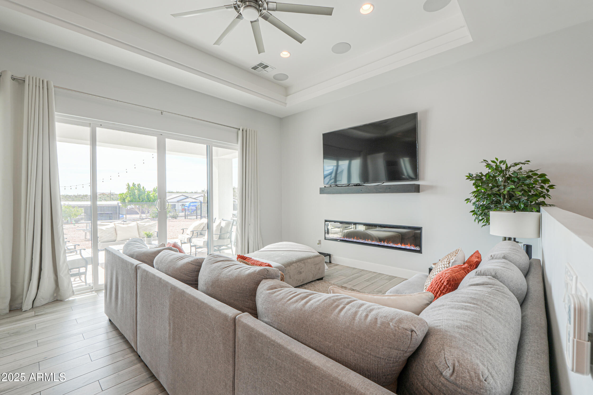 2529 West Magma Road San Tan Valley, AZ 85144 - Photo 18 of 93 a living room with furniture and a flat screen tv