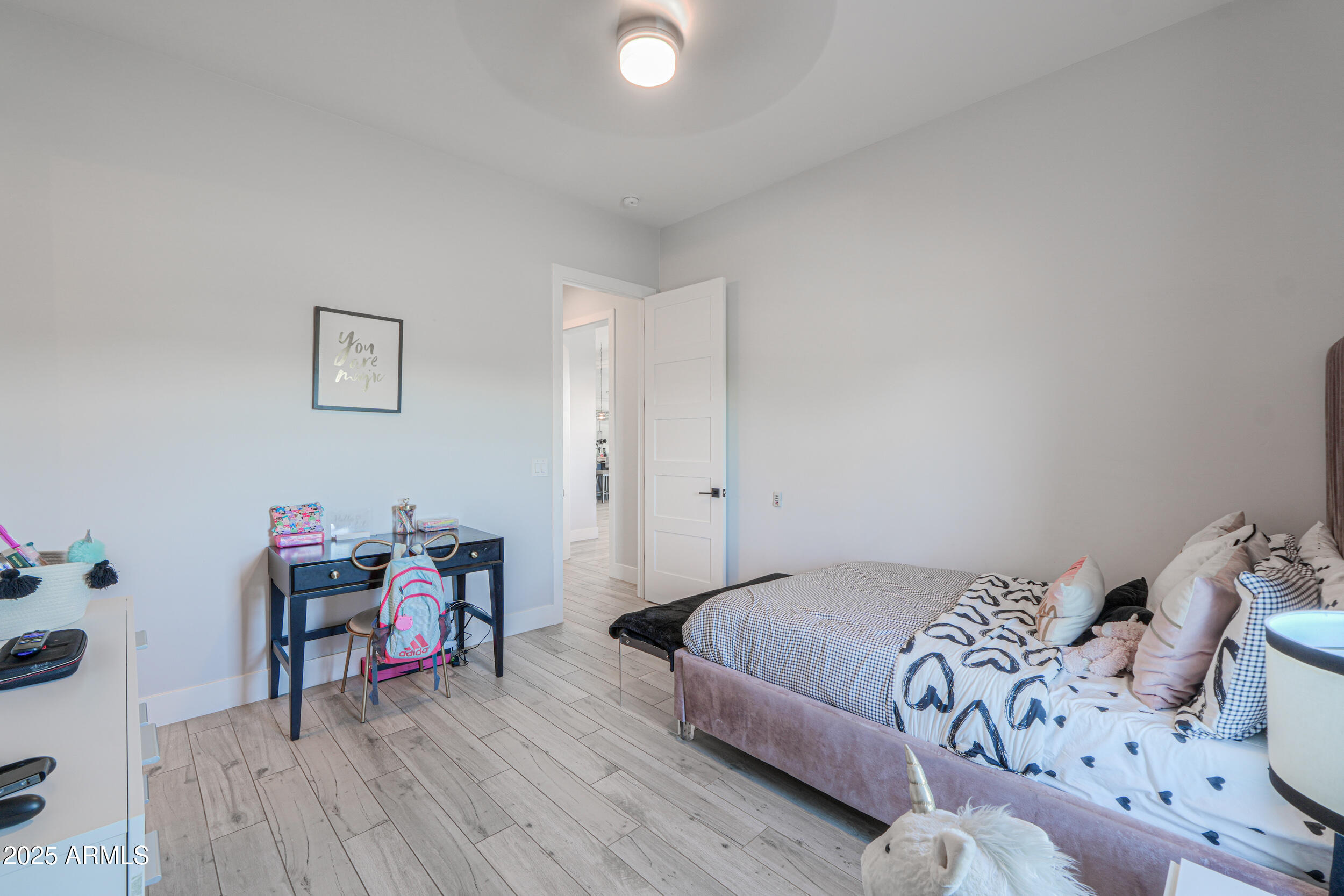 2529 West Magma Road San Tan Valley, AZ 85144 - Photo 28 of 93 a bedroom with a bed and a wooden floor