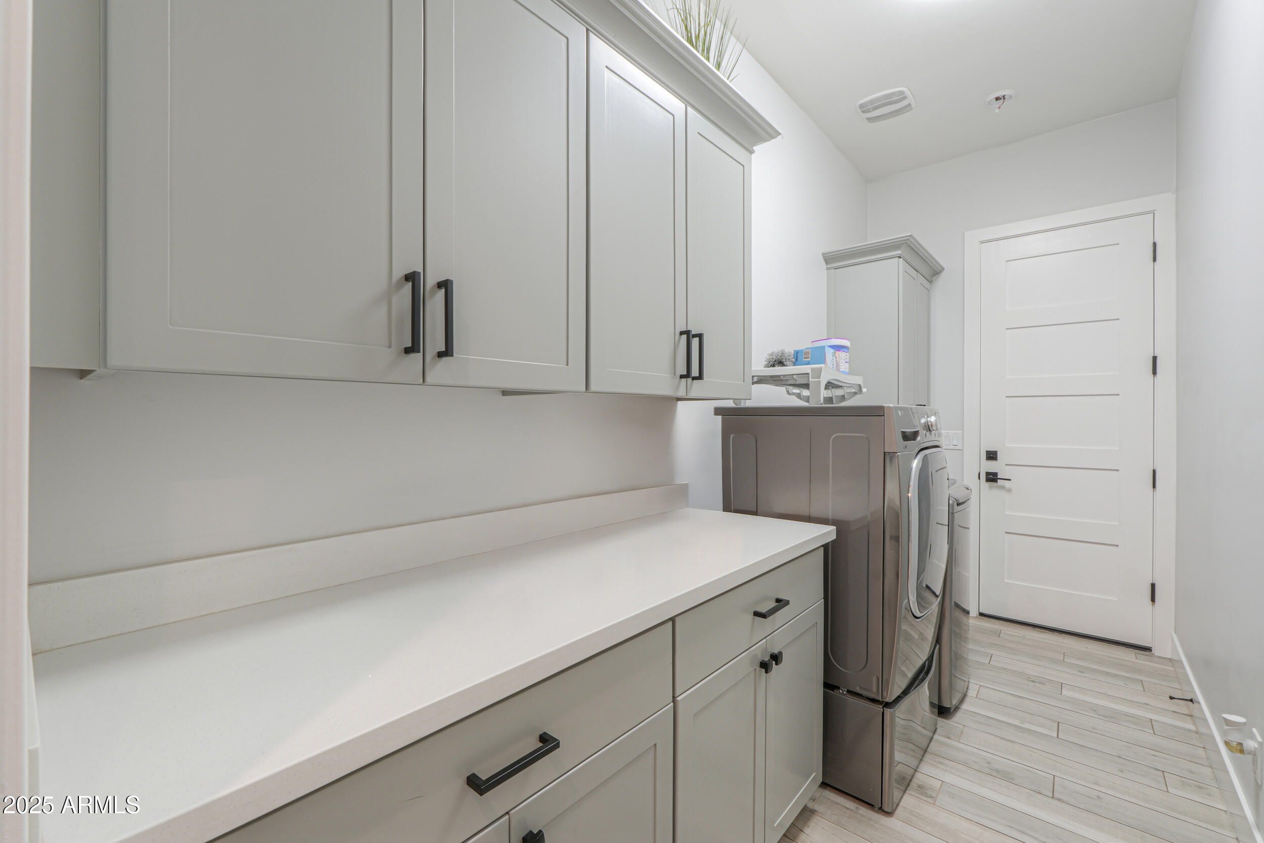 2529 West Magma Road San Tan Valley, AZ 85144 - Photo 30 of 93 a view of cabinets with washer and dryer