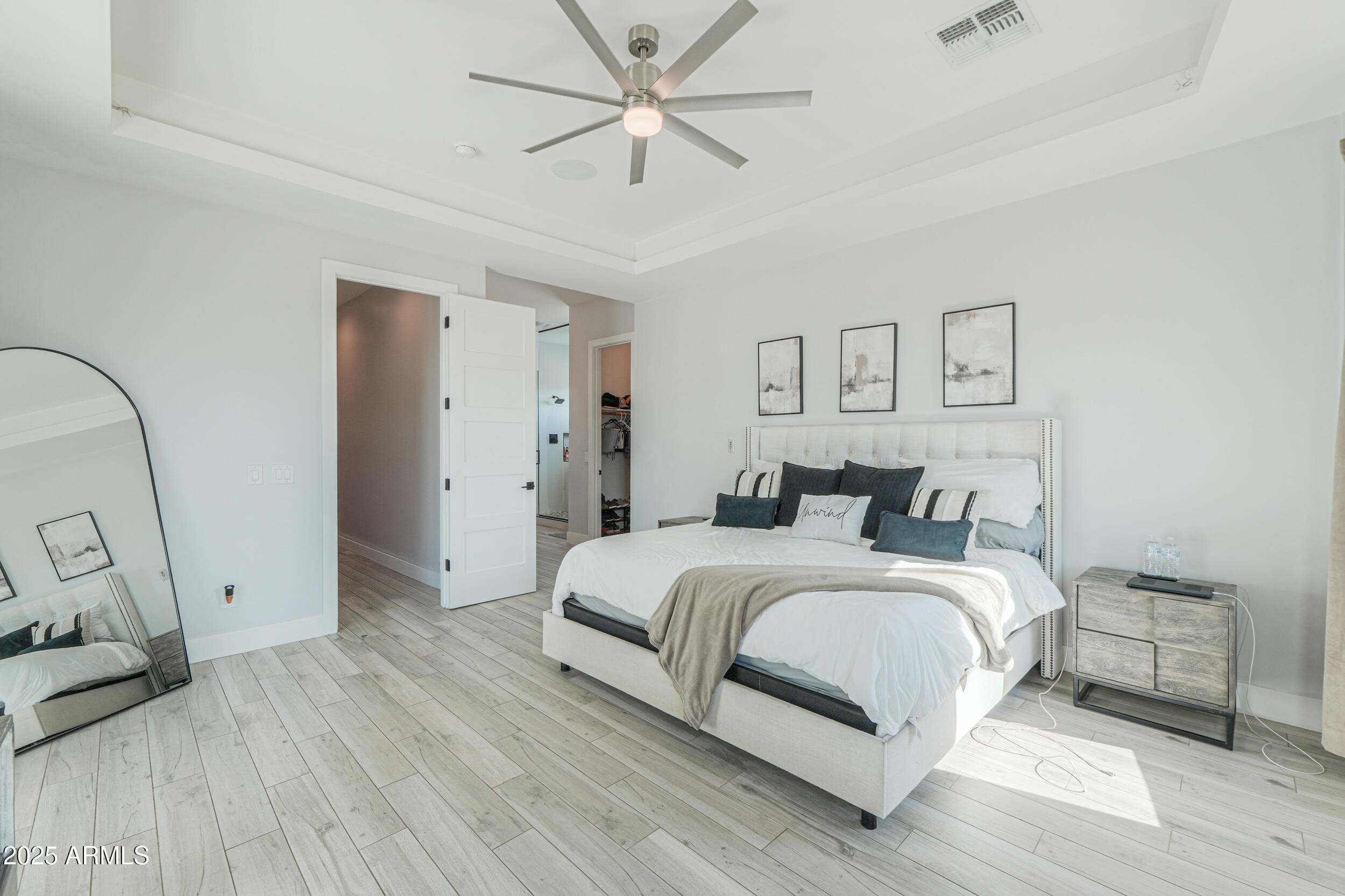 2529 West Magma Road San Tan Valley, AZ 85144 - Photo 32 of 93 a spacious bedroom with a bed and a dresser