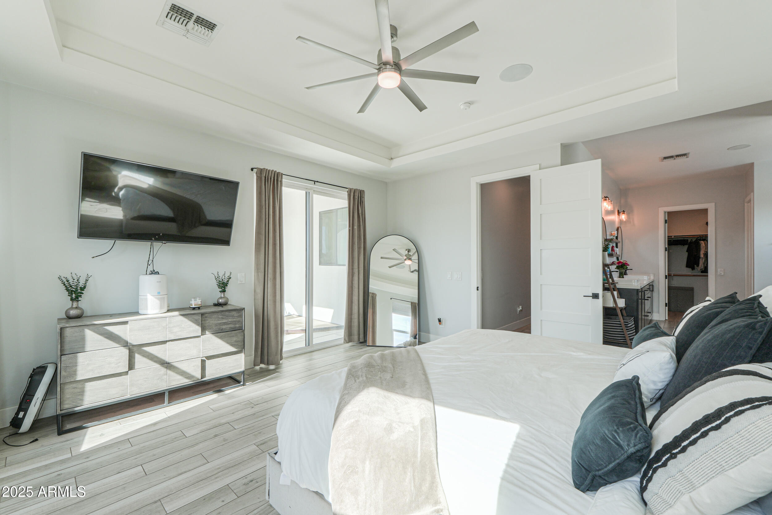 2529 West Magma Road San Tan Valley, AZ 85144 - Photo 33 of 93 a bedroom with a bed mirror on desk and a window