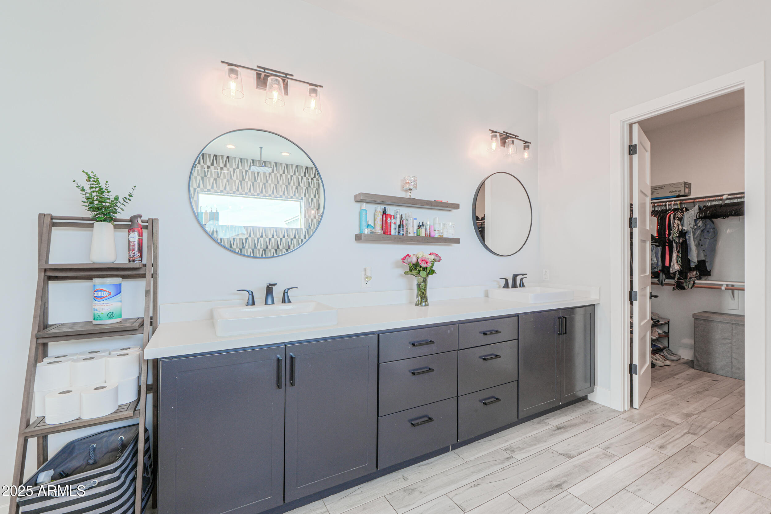 2529 West Magma Road San Tan Valley, AZ 85144 - Photo 35 of 93 a bathroom with a double vanity sink and a mirror