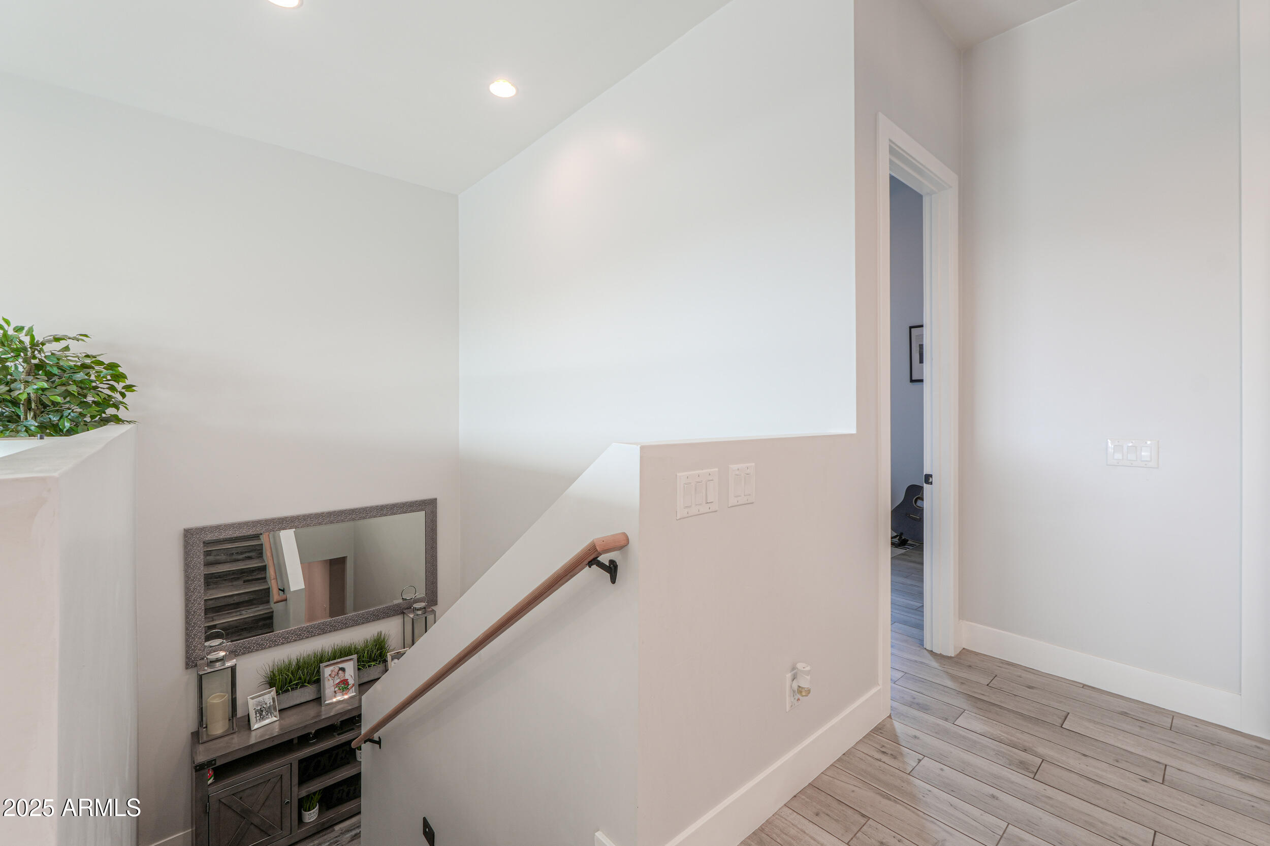2529 West Magma Road San Tan Valley, AZ 85144 - Photo 38 of 93 a view of a hallway with workspace and wooden floor