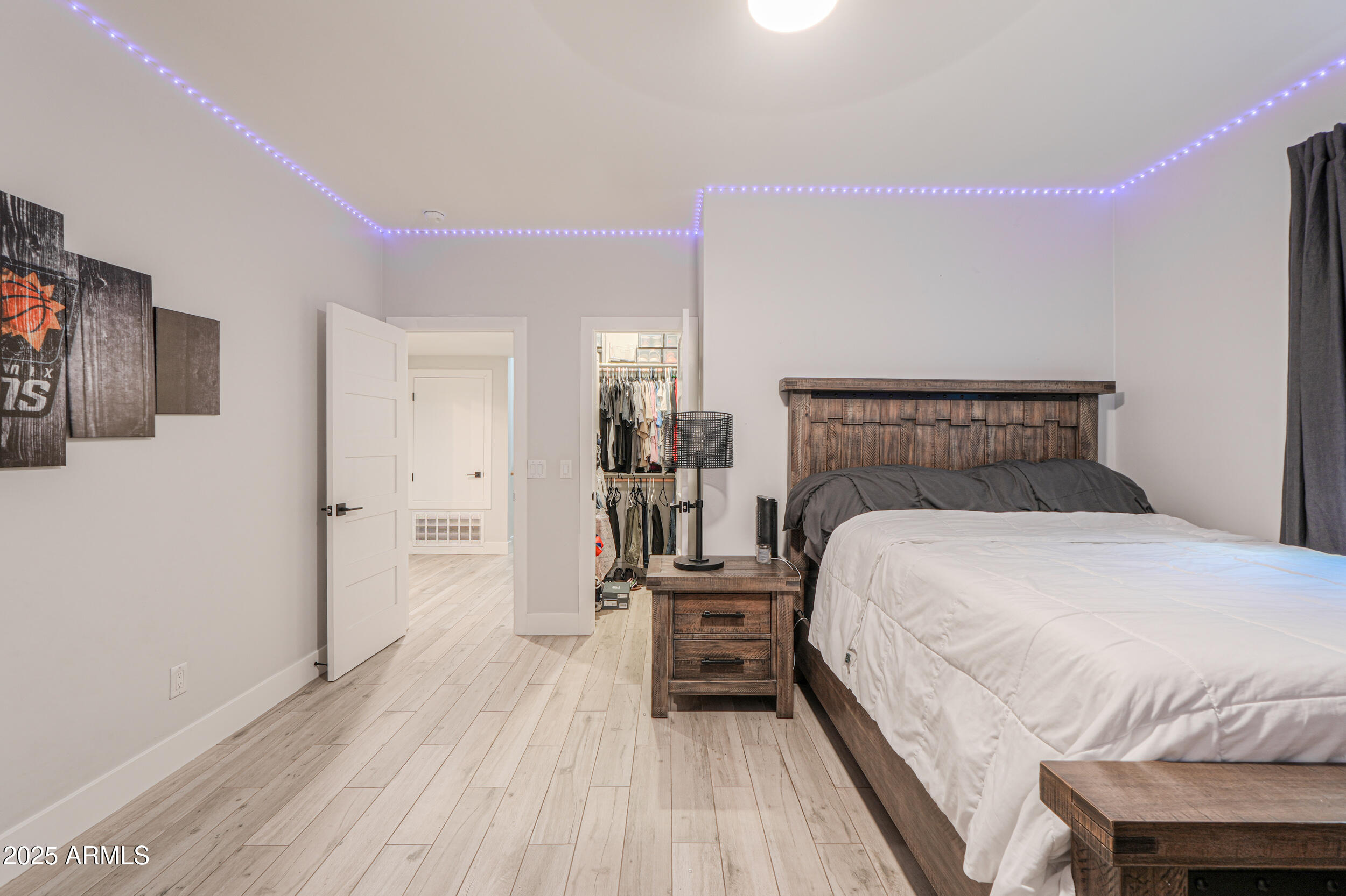 2529 West Magma Road San Tan Valley, AZ 85144 - Photo 48 of 93 a bedroom with a bed and wooden floor