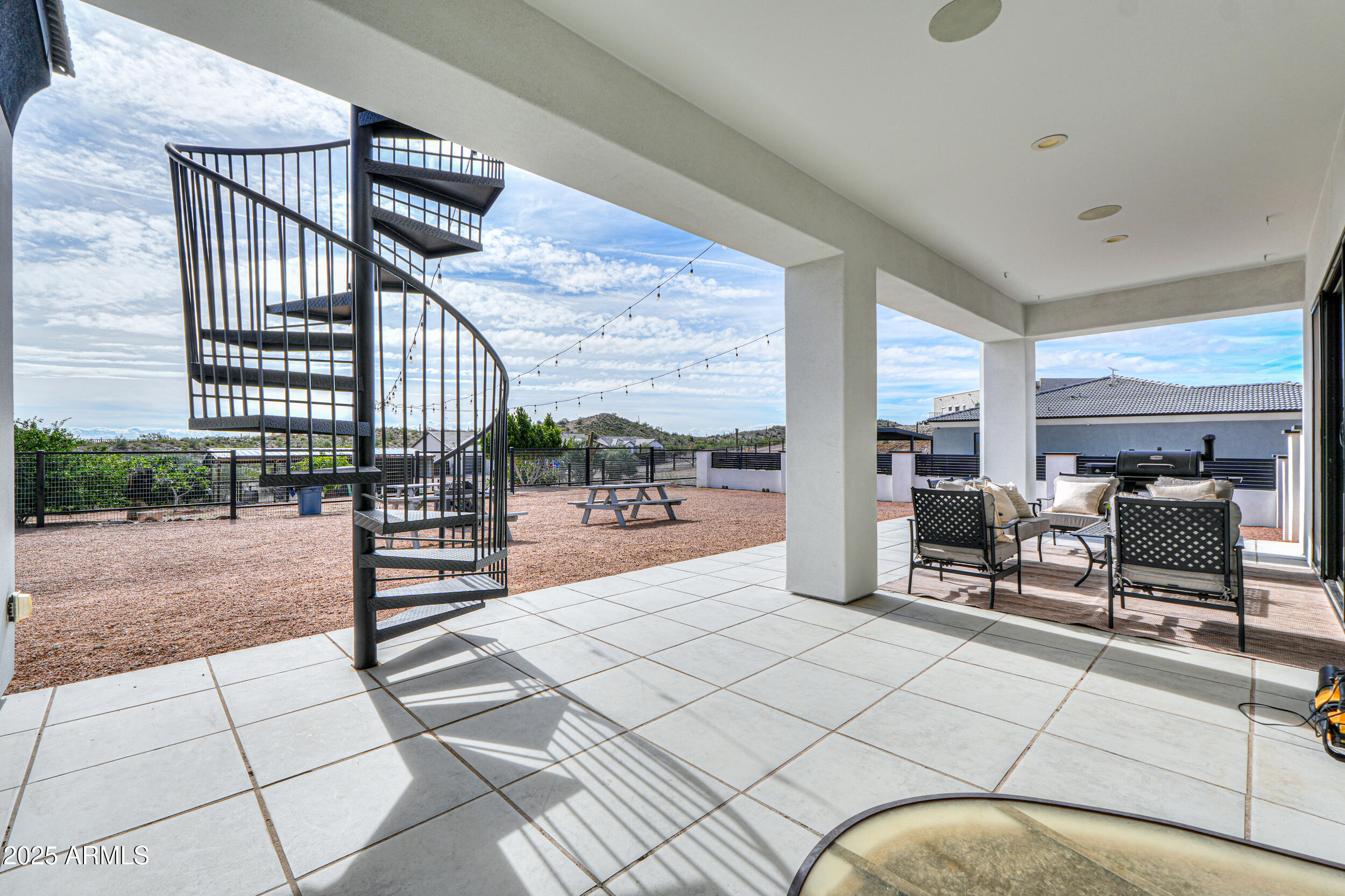 2529 West Magma Road San Tan Valley, AZ 85144 - Photo 57 of 93 a view of living room with patio furniture and a floor to ceiling window