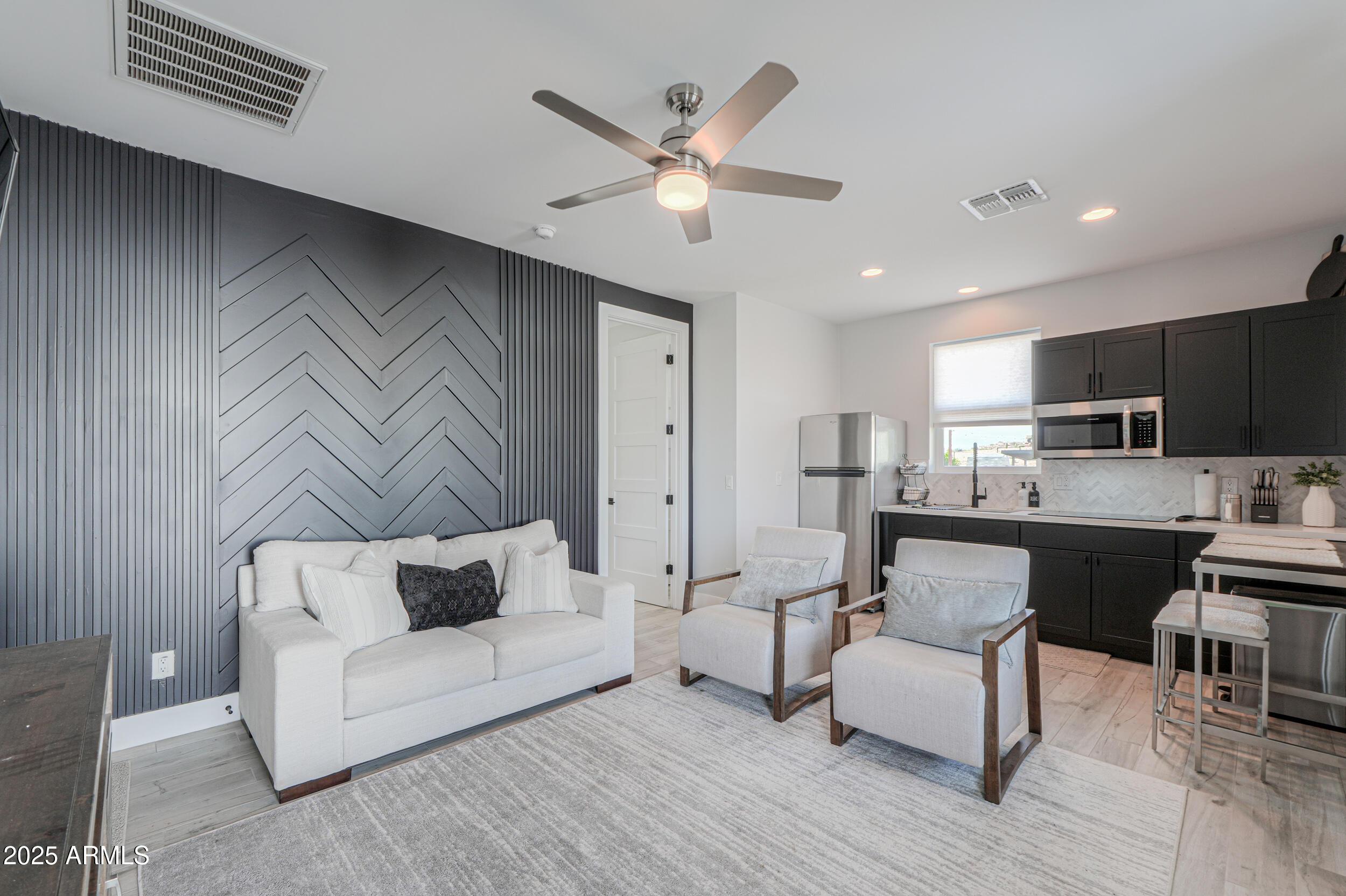 2529 West Magma Road San Tan Valley, AZ 85144 - Photo 66 of 93 a living room with furniture and kitchen view