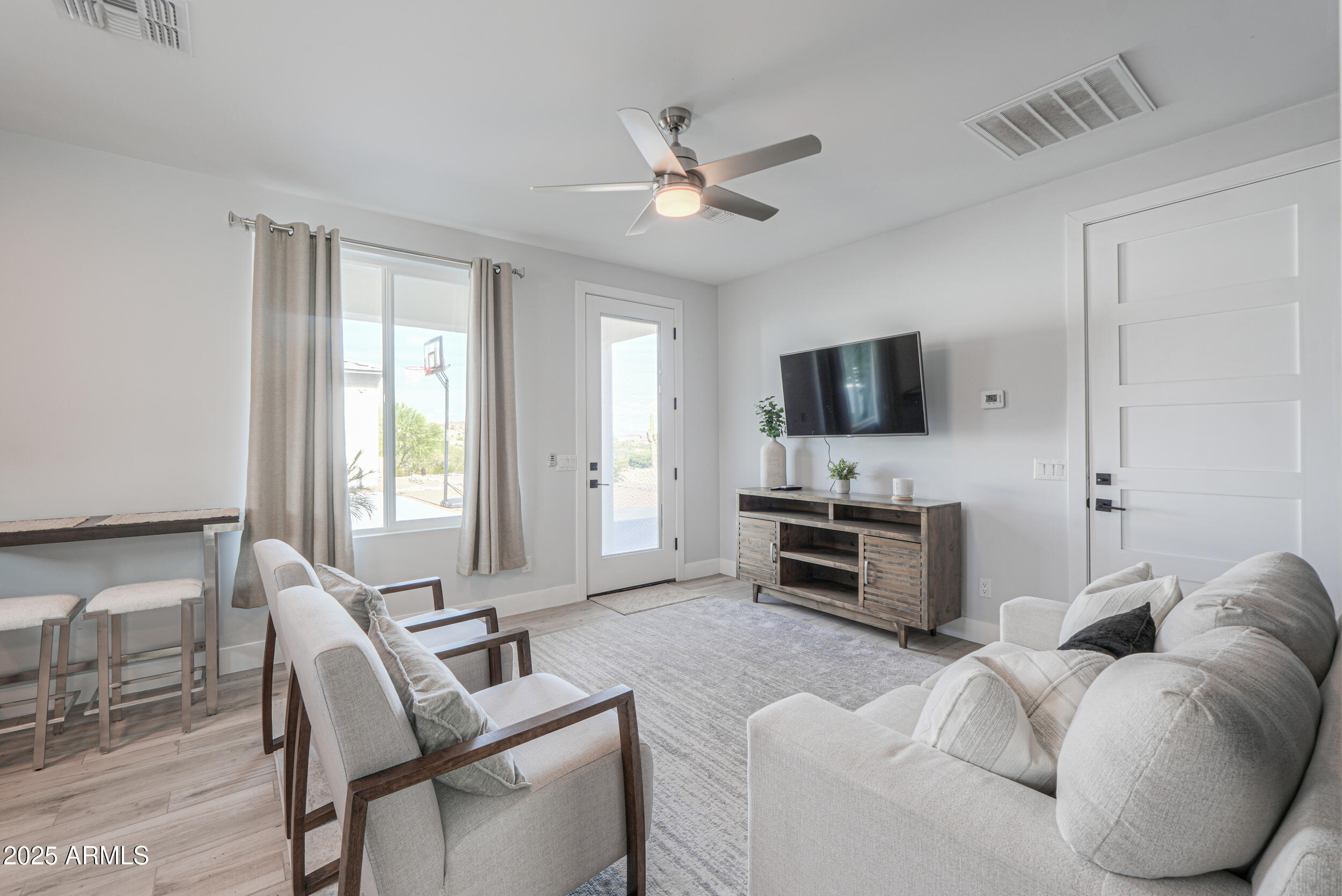 2529 West Magma Road San Tan Valley, AZ 85144 - Photo 68 of 93 a living room with furniture and a flat screen tv