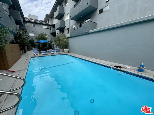 a view of swimming pool with seating area
