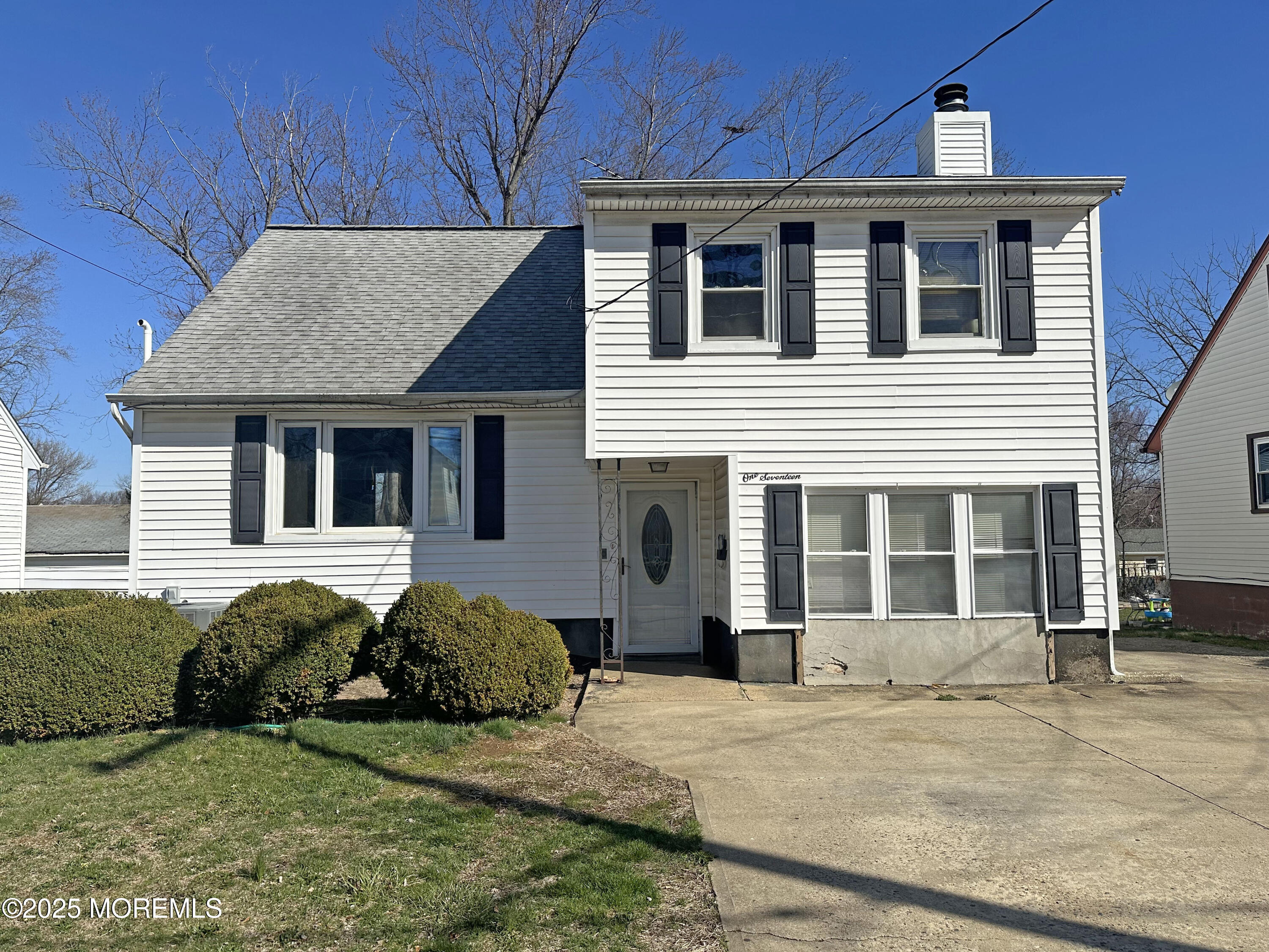 117 Center Street Freehold, NJ 07728 - Photo 1 of 11 a front view of a house with garden