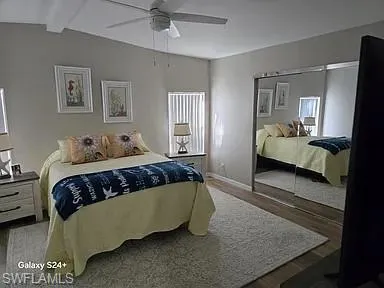a bedroom with a bed and window
