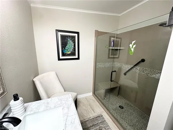 a bathroom with a sink and mirror