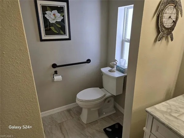 a bathroom with a toilet and a sink