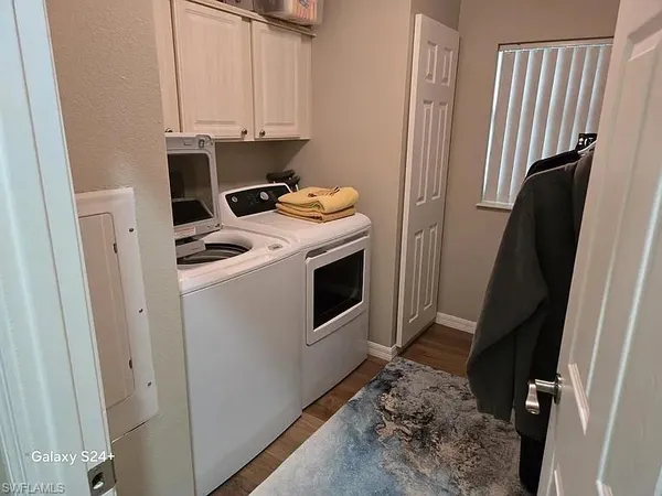 a view of a storage and utility room with a sink