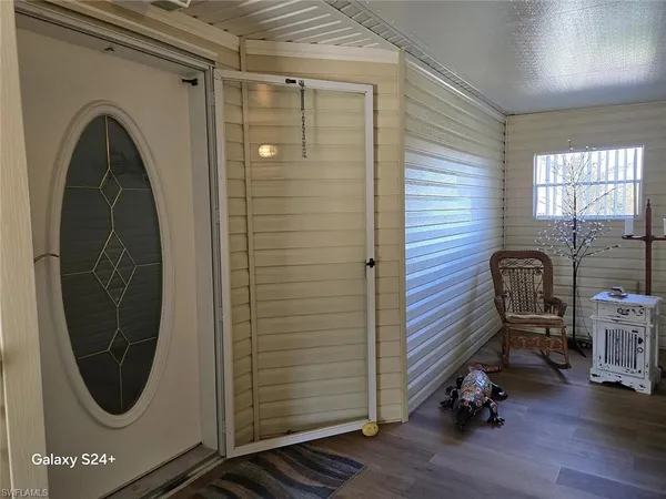 a room with a chair and a mirror