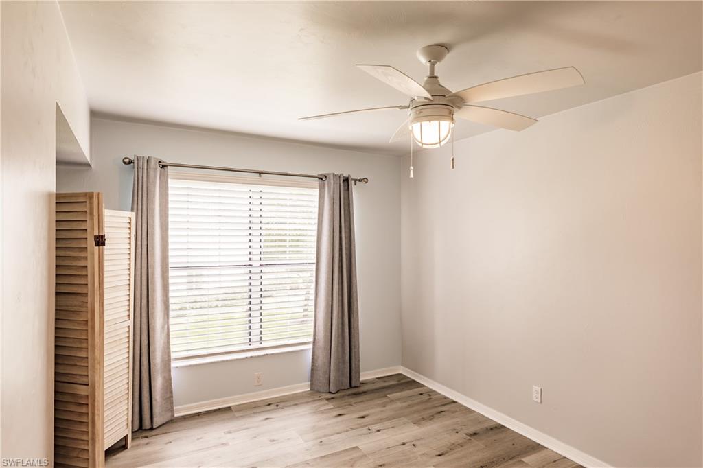2750 Kings Lake Boulevard, Unit 204 Naples, FL 34112 - Photo 27 of 31 a view of an empty room with a window