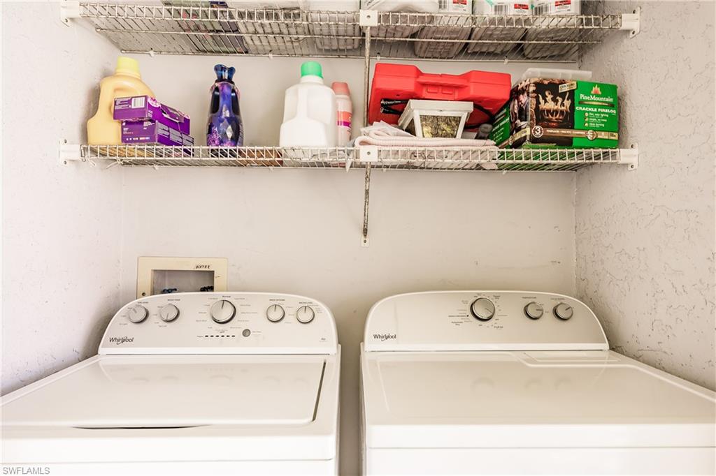 2750 Kings Lake Boulevard, Unit 204 Naples, FL 34112 - Photo 28 of 31 a utility room with dryer and washer